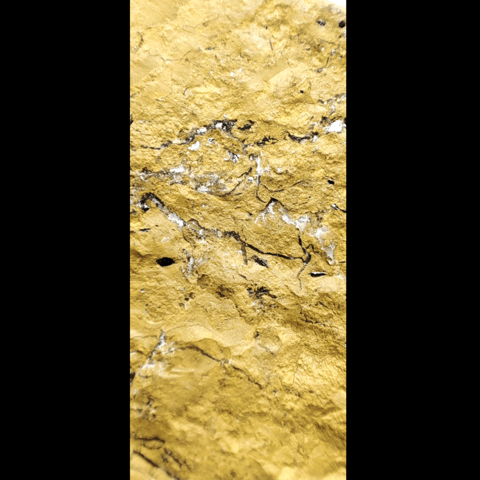 Makroaufnahme der Kristallstruktur eines gelben Jaspis.