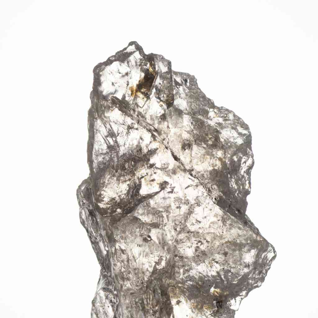 Ein roher, transparenter Danburit Stein mit leicht goldenem Schimmer.